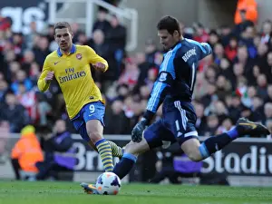 Stoke City V Arsenal 2013-14 Prints: Lukas Podolski Closes In on Asmir Begovic: Intense Moment from Stoke City vs Arsenal (2013-14)