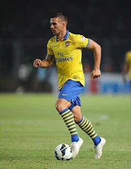 Indonesia Dream Team v Arsenal 2013-14 Collection: Lukas Podolski Faces Indonesia All-Stars: Arsenal Star in Pre-Season Clash, Jakarta 2013