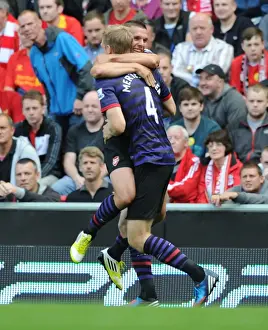 Lukas Podolski and Per Mertesacker Celebrate Arsenal's First Goal Against Liverpool (2012-13)