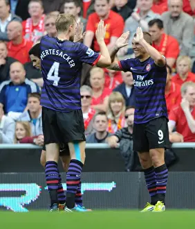 Lukas Podolski and Per Mertesacker Celebrate First Arsenal Goal Against Liverpool (2012-13)