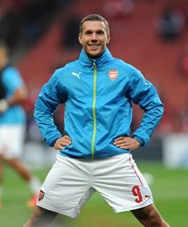 Images Dated 27th August 2014: Lukas Podolski Prepares for Arsenal's UEFA Champions League Clash against Besiktas