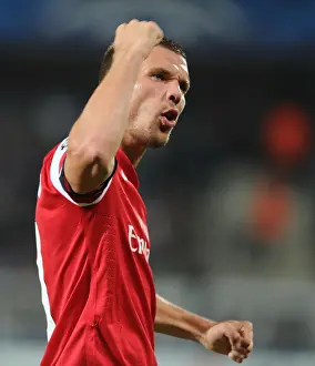 Montpellier V Arsenal 2012-13 Prints: Lukas Podolski Scores First Arsenal Goal in UEFA Champions League Win against Montpellier (September 2012)