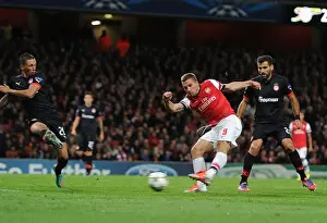 Arsenal V Olympiacos 2012-13 Prints: Lukas Podolski Scores the Second Goal for Arsenal in the UEFA Champions League against Olympiacos (2012)