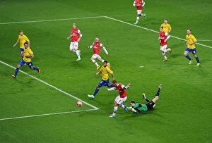 Images Dated 24th January 2014: Lukas Podolski Scores Stunner Past Joe Murphy in Arsenal's FA Cup Victory