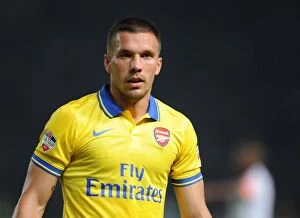 Indonesia Dream Team v Arsenal 2013-14 Collection: Lukas Podolski Shines in Arsenal's Victory against Indonesia All-Stars, 2013