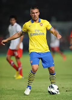 Indonesia Dream Team V Arsenal 2013-14 Prints: Lukas Podolski Shines in Arsenal's Victory against Indonesia All-Stars, 2013