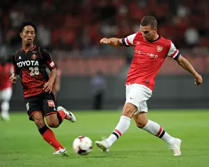Nagoya Grampus V Arsenal 2013-14 Prints: Lukas Podolski vs. Taishi Taguchi: Nagoya Grampus vs. Arsenal, 2013