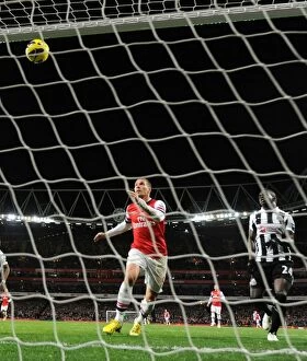 Arsenal v Newcastle United 2012-13 Collection: Lukas Podolski's Hat-Trick: Arsenal Crushes Newcastle United in Premier League (December 2012)