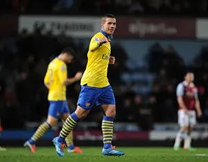 West Ham United V Arsenal 2013-14 Prints: Lukas Podolski's Hat-Trick: Arsenal Crushes West Ham United in Premier League Showdown (December 2013)