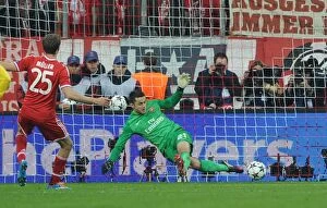 Bayern Munich v Arsenal 2013-14 Collection: Lukasz Fabianski Saves Thomas Muller's Penalty: Arsenal vs. Bayern Munich