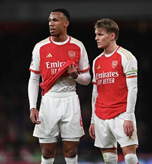 Images Dated 28th December 2023: Magalhaes and Odegaard in Action: Arsenal's Winning Duo vs. West Ham United (2023-24)