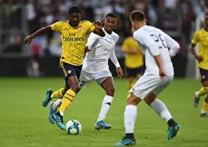 Angers SCO V Arsenal 2019-20 Prints: Maitland-Niles vs. Reine-Adelaide: Clash in Angers Friendly