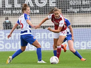 Malin Gut of Arsenal Outmaneuvers Angharad James of Reading in FA WSL Clash