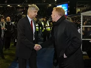 Images Dated 1st January 2011: Managers Arsene Wenger (Arsenal) and Alex McLeish (Birmingham) shake hands before the match