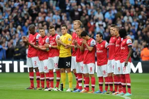 Manchester City V Arsenal 2012:13 Prints: Manchester Derby: Unity in Mourning - Arsenal and Manchester City Honor Fallen Policewomen (23/9/12)
