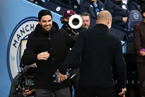 Manchester Rivalry: United Front - Arteta and Guardiola's Pre-Match Embrace (2022-23)