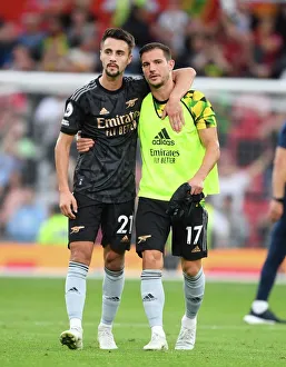 Manchester United vs. Arsenal: 2022-23 Premier League Showdown - Arsenal Players Fabio Vieira and Cedric Celebrate