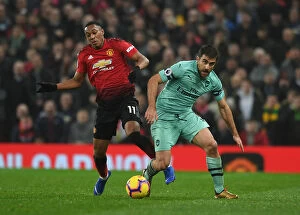 Manchester United v Arsenal 2018-19 Collection: Manchester United vs Arsenal: Sokratis Faces Off Against Anthony Martial in Premier League Clash