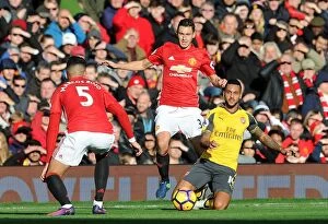Images Dated 19th November 2016: Manchester United vs. Arsenal: Theo Walcott Tripped by Matteo Darmian (Premier League 2016-17)