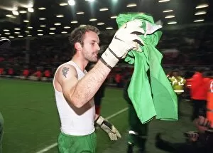 Liverpool v Arsenal - Carling Cup Collection: Manuel Almunia (Arsenal) throws his shirt to the fans after the match