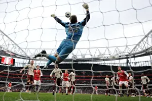 Marouane Chamakh, Andrey Arshavin and Nicklas Bendtner (Arsenal) look on as Simon Mignolet