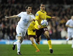 Leeds United v Arsenal FA Cup 2010-11 Collection: Marouane Chamakh (Arsenal) Alex Bruce (Leeds). Leeds United 1: 3 Arsenal