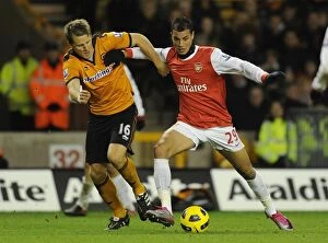 Images Dated 10th November 2010: Marouane Chamakh (Arsenal) Christophe Berra (Wolves). Wolverhampton Wanderers 0: 2 Arsenal