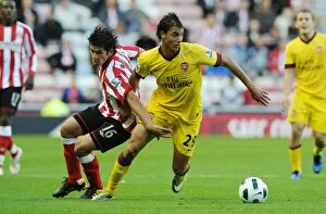 Sunderland v Arsenal 2010-11 Collection: Marouane Chamakh (Arsenal) Cristian Riveros (Sunderland). Sunderland 1: 1 Arsenal