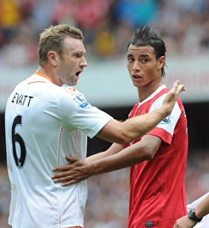 Marouane Chamakh (Arsenal) and Ian Evatt (Blackpool). Arsenal 6:0 Blackpool Marouane Chamakh (Arsenal) and Ian Evatt (Blackpool). Arsenal 6:0 Blackpool