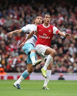 Images Dated 30th October 2010: Marouane Chamakh (Arsenal) Manuel Da Costa (West Ham). Arsenal 1: 0 West Ham United