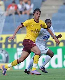 Sturm Graz V Arsenal 2010-11 Prints: Marouane Chamakh (Arsenal) Pa Siko Kujabi (Sturm Graz). Sturm Graz 0: 4 Arsenal