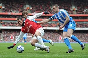 Images Dated 30th January 2011: Marouane Chamakh (Arsenal) Peter Clarke (Huddersfield). Arsenal 2: 1 Huddersfield Town