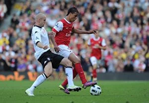 Images Dated 22nd May 2011: Marouane Chamakh (Arsenal) Philippe Senderos (Fulham). Fulham 2: 2 Arsenal