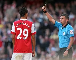 Images Dated 25th September 2010: Marouane Chamakh (Arsenal) is shown the yellow card. Arsenal 2: 3 West Bromwich Albion
