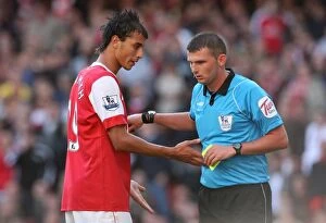 Arsenal v West Bromwich Albion 2010-11 Gallery: Marouane Chamakh (Arsenal) talks to Referee Michael Oliver. Arsenal 2: 3 West Bromwich Albion