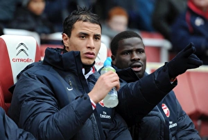 Arsenal v Wigan Athletic 2010-11 Collection: Marouane Chamakh and Emmanuel Eboue (Arsenal). Arsenal 3: 0 Wigan Athletic