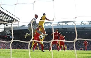 Marouane Chamakh jumps with Liverpool goalkeeper Pepe Reina. Liverpool 1: 1 Arsenal