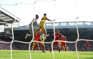 Liverpool V Arsenal 2010-11 Prints: Marouane Chamakh jumps with Liverpool goalkeeper Pepe Reina. Liverpool 1: 1 Arsenal