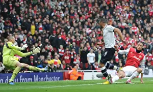 Marouane Chamakh scores Arsenals 2nd goal under pressure from Younes Kaboul