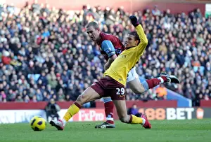 Aston Villa V Arsenal 2010-11 Prints: Marouane Chamakh scores Arsenals 3rd goal under pressure from Richard Dunne (Villa)
