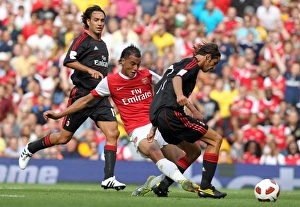 Marouane Chamakh scores Arsenals goal past Luca Antonini (Milan). Arsenal 1 Marouane Chamakh scores Arsenals goal past Luca Antonini (Milan). Arsenal 1