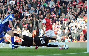Marouane Chamakh shoots past Birmingham goalkeeper Ben Foster to score the 2nd Arsenal Marouane Chamakh shoots past Birmingham goalkeeper Ben Foster to score the 2nd Arsenal