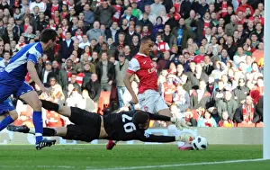 Marouane Chamakh shoots past Birmingham goalkeeper Ben Foster to score the 2nd Arsenal goal