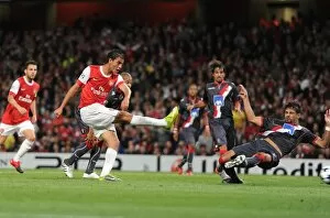 Marouane Chamakh shoots past Braga goalkeeper Felipe to score the 3rd Arsenal goal