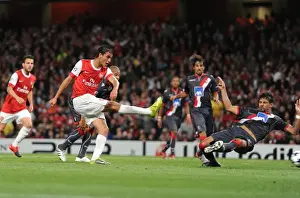 Arsenal V SC Braga 2010-11 Prints: Marouane Chamakh shoots past Braga goalkeeper Felipe to score the 3rd Arsenal goal
