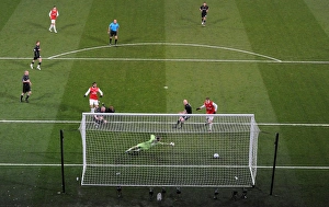 Marouane Chamakh shoots past Orient goalkeeper Jamie Jones to score the 1st Arsenal goal