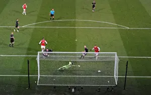 Marouane Chamakh shoots past Orient goalkeeper Jamie Jones to score the 1st Arsenal goal