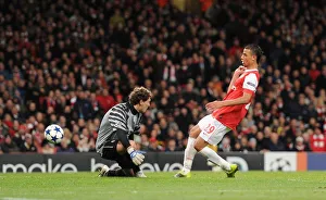 Arsenal v Shaktar Donetsk 2010 - 11 Collection: Marouane Chamakh shoots past Shakhtar goalkeeper Andriy Pyatov to score the 5th Arsenal goal
