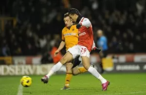 Wolverhampton Wanderers v Arsenal 2010-11 Collection: Marouane Chamakh shoots past Wolves goalkeeper Marcus Hahnemann to score the 2nd Arsenal goal