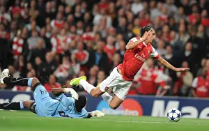 Arsenal V SC Braga 2010-11 Prints: Marouane Chamakh is tripped by Braga goalkeeper Felipe for the Arsenal penalty